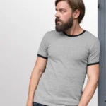 Image of male model wearing GILDAN 76600 Ringer T Shirt, GILDAN 76600 (UNISEX) in RS Sport Grey / Navy