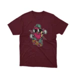 Apparel by Cetakshop Delicious Strawberry Character graphic tee, featuring a stylized design on a Maroon background.