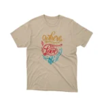 Live and love with Apparel by Cetakshop's 'Where There Is Love There Is Life' graphic tee, a vibrant message on Sand fabric.