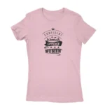 Image of a Light Pink 'Confident Women Empower Women' T-shirt by Apparel by Cetakshop, promoting women's empowerment and unity with an inspirational message.