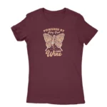 Women's Maroon T-shirt with 'Powered by Fairy Dust and Wine' print, a whimsical creation by Apparel by Cetakshop.