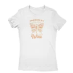 Fairy Dust and Wine Tee by Apparel by Cetakshop. T Shirt for women decorated with 'Powered by Fairy Dust and Wine' print, a whimsical creation.