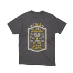 A Dark Heather tee with 'Muscular Dad' text, celebrating cool dads everywhere, from Apparel by Cetakshop.