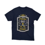 A Navy tee with 'Muscular Dad' text, celebrating cool dads everywhere, from Apparel by Cetakshop.