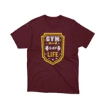 A Maroon tee with 'Gym is My Life' text, inspiring fitness enthusiasts, from Apparel by Cetakshop.