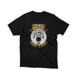A Black tee with 'The Real Workout' encouragement, for the relentless, by Apparel by Cetakshop. The image shows a weight lifting t shirt.