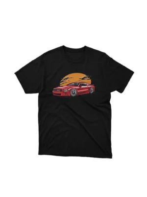 A Black tee with a classic car under a sunset design, from Apparel by Cetakshop, for vintage car lovers. The image shows a classic muscle car graphic tees.