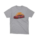 A Sport tee with a classic car under a sunset design, from Apparel by Cetakshop, for vintage car lovers.