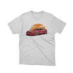 A White tee with a classic car under a sunset design, from Apparel by Cetakshop, for vintage car lovers.