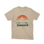A Sand tee with a 'Bassquatch' playing the guitar, from Apparel by Cetakshop, for those who believe in the beat.