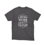 A Dark Heather tee that reads 'I Am Not Weird I Am Limited Edition', celebrating individuality, from Apparel by Cetakshop.