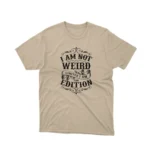 A Sand tee that reads 'I Am Not Weird I Am Limited Edition', celebrating individuality, from Apparel by Cetakshop.