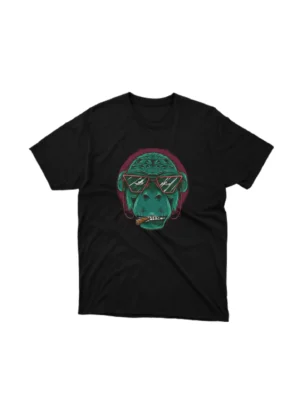 Black graphic tee from Apparel by Cetakshop featuring a gorilla wearing glasses, blending urban cool with wildlife. The image shows a gorilla with glasses graphic tees.