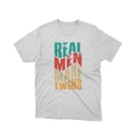 A playful 'Real Men Make Twins' slogan on a white graphic tee from Apparel by Cetakshop, ideal for dads with a sense of humor.