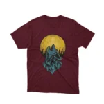 A Maroon tee featuring a howling wolf in front of a full moon, from Apparel by Cetakshop, invoking the call of the wild.