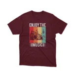 A Maroon tee with a vibrant retro music player design, from Apparel by Cetakshop, a blast from the past.