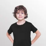 Image of young model wearing NORTH HARBOUR Kids Plain black T Shirt. NHR1100B is a kids plain t shirt