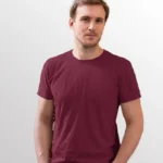 Image of male model wearing NORTH HARBOUR T-Shirt, NHR 1100 Soft Touch Round Neck T-Shirt in Maroon