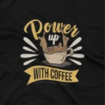 close up image of Energize your day with Apparel by Cetakshop's 'Power Up With Coffee' graphic tee, your caffeine boost on Black fabric. The image shows a power up with coffee graphic tees.