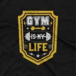 close up image of A Black tee with 'Gym is My Life' text, inspiring fitness enthusiasts, from Apparel by Cetakshop. The image shows a gym is my life graphic tees.