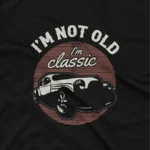 close up image of A Black tee with a 'Classic Car' emblem, from Apparel by Cetakshop, for lovers of timeless style. The image shows a classic car graphic tees.