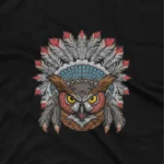 close up image of A Black tee with a detailed tribal owl design, from Apparel by Cetakshop, for the insightful and discerning. The image shows a tribal dusky eagle owl graphic tees.