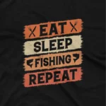 close up image of A Black tee with 'I'd Rather Be Fishing' text, for those who yearn for the lake, from Apparel by Cetakshop. The image shows a funny fishing t shirt.