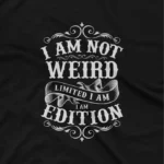 close up image of A Black tee that reads 'I Am Not Weird I Am Limited Edition', celebrating individuality, from Apparel by Cetakshop. The image shows a quirky quote t shirt.