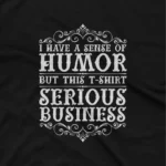 close up image of A Black tee with a humorous yet serious message, for the fun yet focused, from Apparel by Cetakshop. The image shows a funny quote graphic tees.
