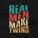 close up image of A playful fatherhood message t shirt that mentions 'Real Men Make Twins' slogan on a black graphic tee from Apparel by Cetakshop, ideal for dads with a sense of humor. The image shows a real men make twins graphic tees.