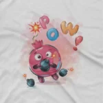 close up image of Pomegranate Superhero Tee by Apparel by Cetakshop. Children’s White t-shirt with a pomegranate character as a superhero, complete with explosion effects, from Apparel by Cetakshop.