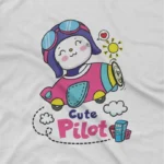 close up image of Cute Pilot Tee by Apparel by Cetakshop. Kids' White t-shirt featuring a Cute Pilot in an airplane, ideal for little adventurers.