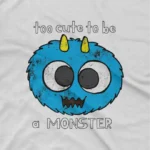 close up image of Too Cute to be a Monster Tee by Apparel by Cetakshop. Too Cute to be a Monster kids t-shirt design from Apparel by Cetakshop on a white tee.