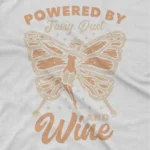 close up image of Fairy Dust and Wine Tee by Apparel by Cetakshop. T Shirt for women decorated with 'Powered by Fairy Dust and Wine' print, a whimsical creation.