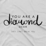 close up image of Diamond Strength Tee by Apparel by Cetakshop. T Shirt for women decorated with 'You are a diamond, dear' typography design print with elegant script and diamond graphic, embodying resilience and grace.